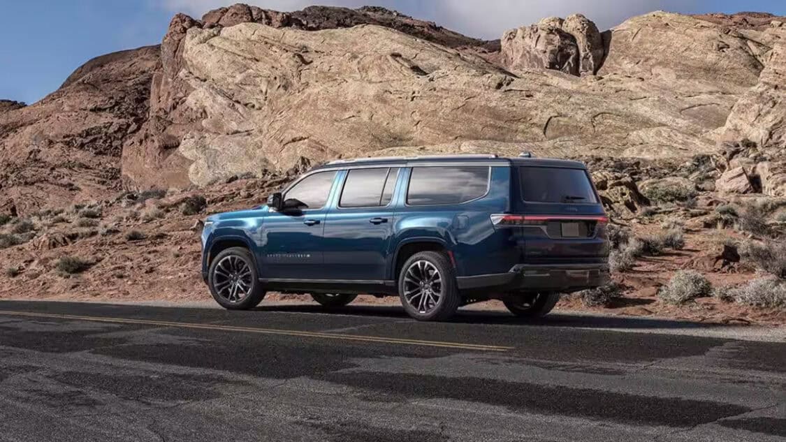 Side profile of the 2026 Jeep Grand Wagoneer showing its full-size design and LED taillights.