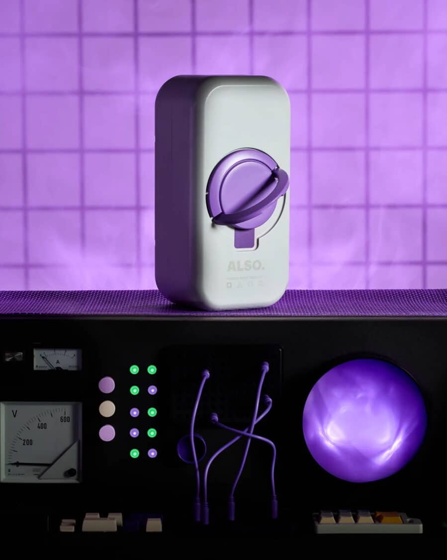 Close-up of the ALSO TM-B e-bike’s removable battery pack displayed under purple lighting.