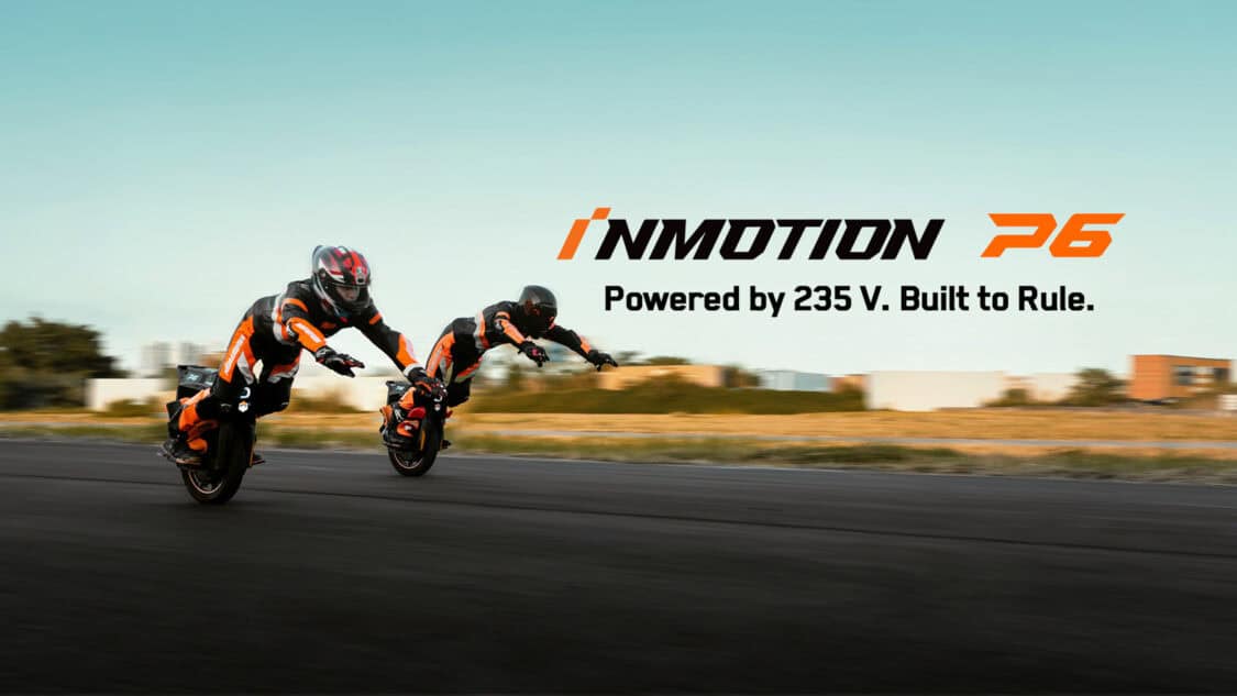Two riders race on InMotion P6 electric unicycles with the slogan “Powered by 235 V. Built to Rule” displayed across the banner.