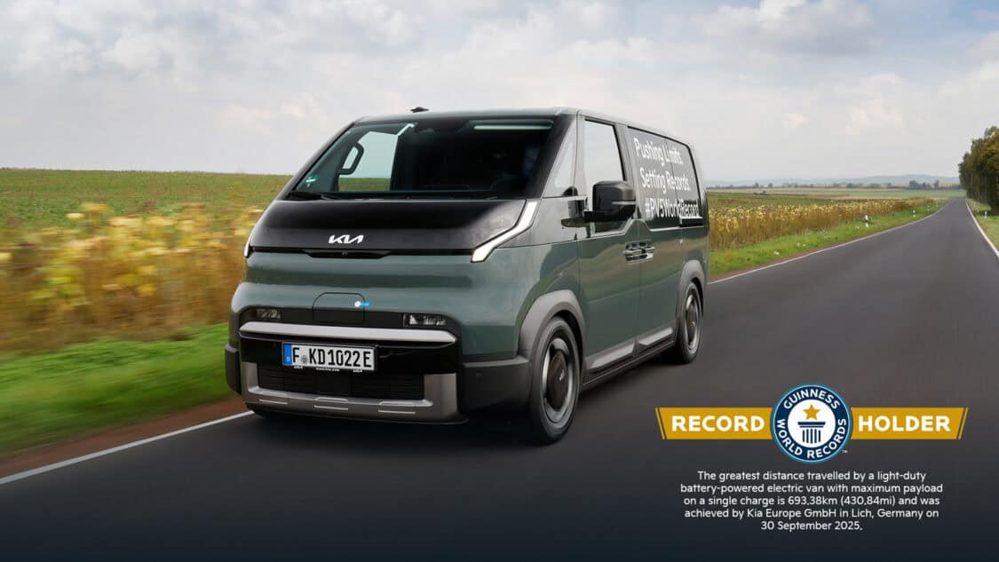 Kia PV5 Cargo electric van driving on a country road after breaking a Guinness World Record for 693 km (430 mi) on one charge.