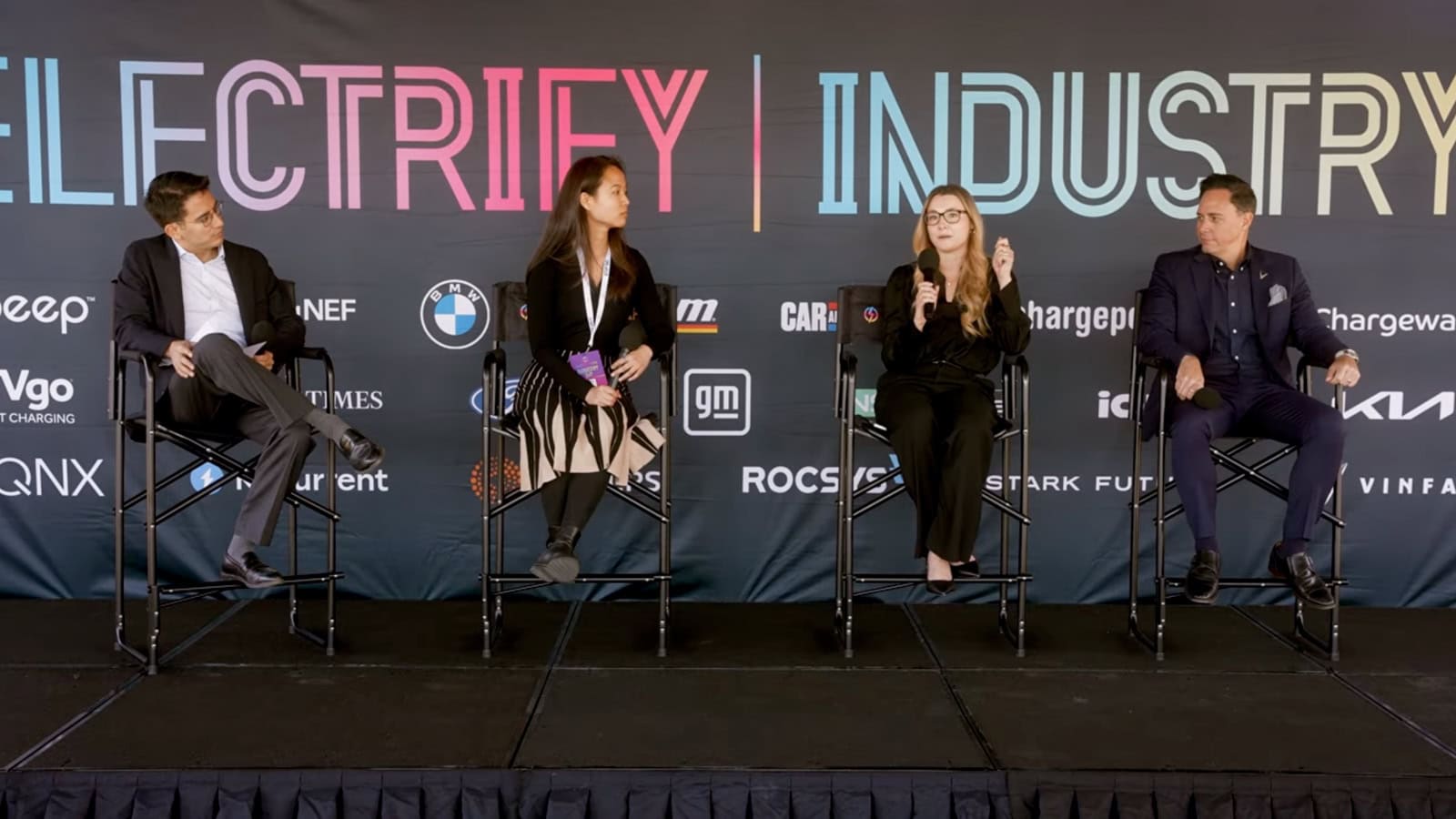 Panelists at Electrify Expo Industry Day discuss EV pricing and the real cost of ownership during a live session on stage.