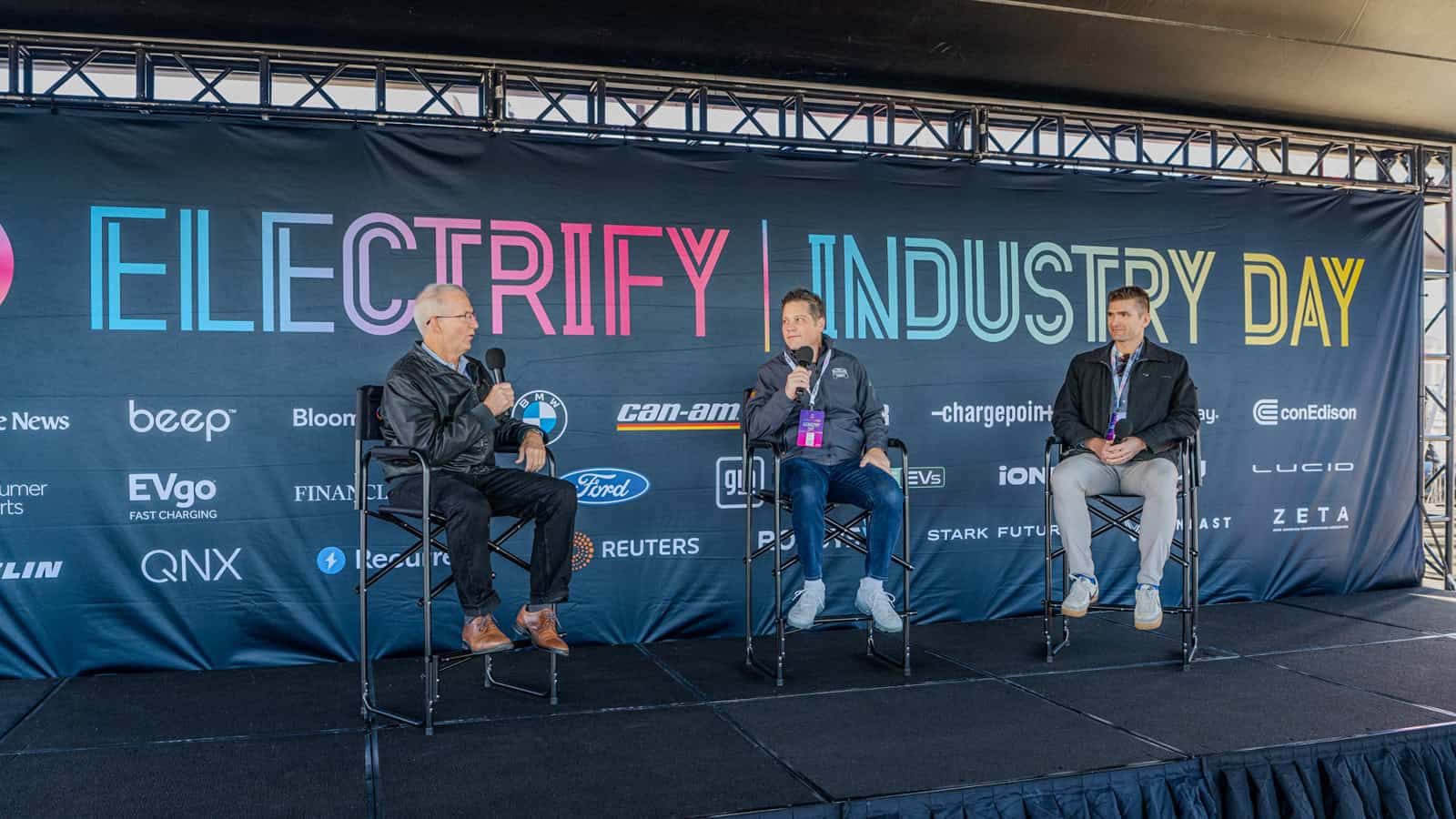 Panel discussion at Electrify Expo Industry Day featuring John Voelcker, GM engineer Andy Oury, and Stark Future’s Dan Quick talking EV range and charging.