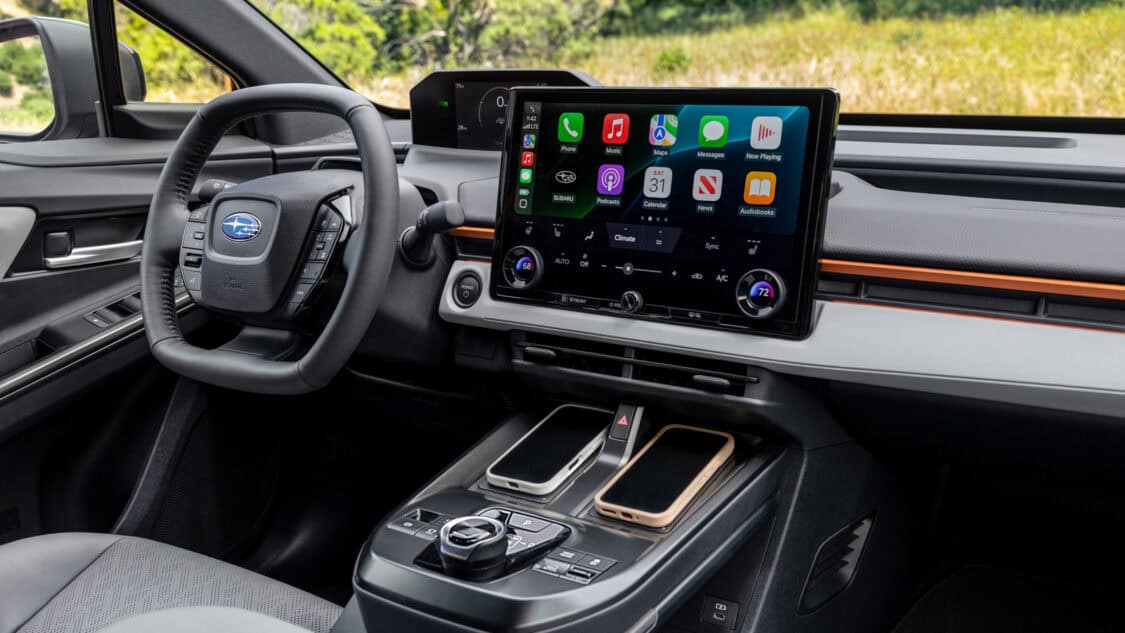 2026 Subaru Uncharted interior with a 14 inch touchscreen, wireless phone chargers, and driver focused controls.