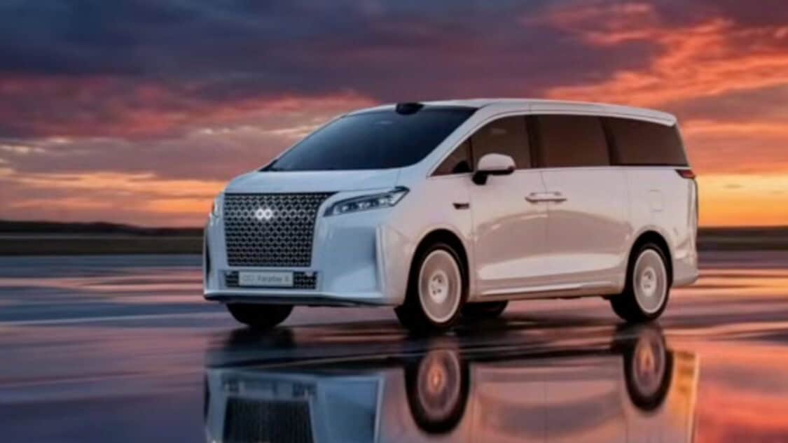 Faraday Future FX Super One electric MPV driving at sunset in promotional image highlighting premium design and EAI technology.