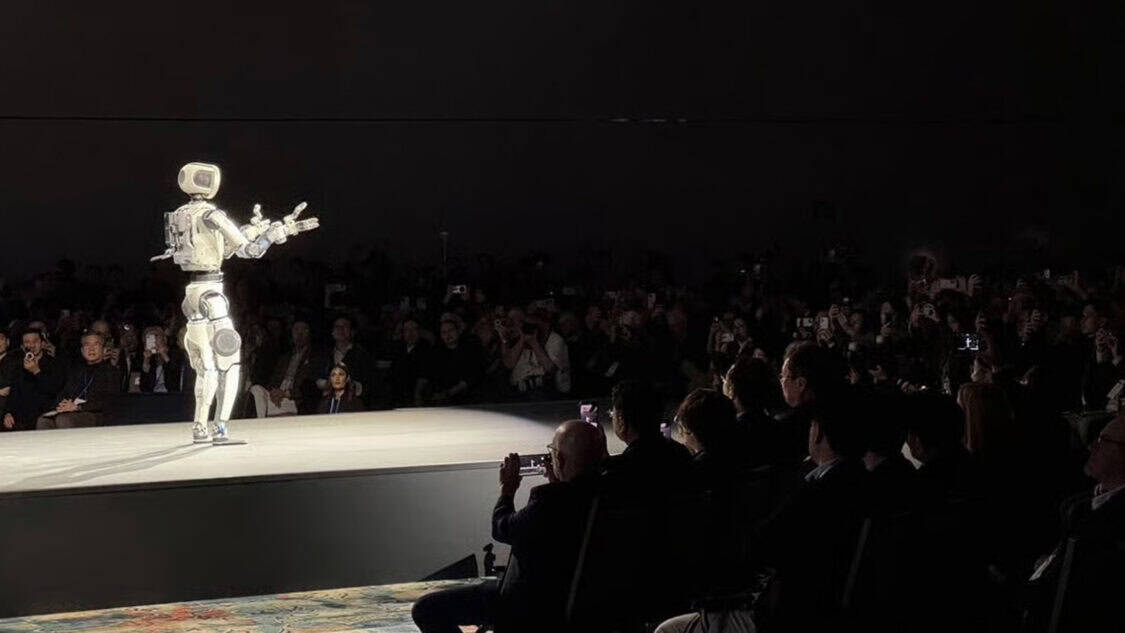 Atlas robot presenting on stage at CES 2026 as Hyundai and Boston Dynamics outline real world industrial robotics for factory use.