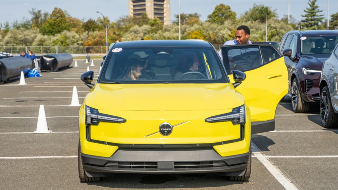 Volvo EX30 electric SUV during a test drive experience at Electrify Expo with attendees inside the vehicle