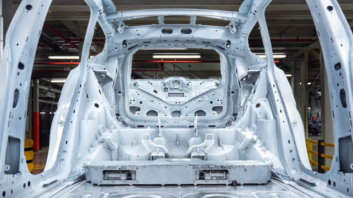 Volvo EX60 electric SUV body structure during manufacturing